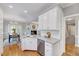 Corner view of an open kitchen with granite countertops and stainless steel dishwasher at 100 Pebble Ridge Farms Ct, Cary, NC 27513