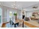 Combined dining and living area with hardwood floors, elegant lighting and open floorplan at 100 Pebble Ridge Farms Ct, Cary, NC 27513