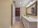 Bathroom with a tiled shower and tub, adjacent to a vanity with white cabinetry, offering functionality at 101 Sundance Pl, Chapel Hill, NC 27514