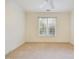 Bedroom boasts neutral carpet, modern ceiling fan and bright natural light from window at 101 Sundance Pl, Chapel Hill, NC 27514