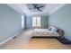 Spacious bedroom features neutral carpeting, crown molding, ceiling fan, and two windows at 101 Sundance Pl, Chapel Hill, NC 27514