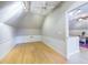 This bonus room features hardwood floors, vaulted ceilings, and white wainscoting at 101 Sundance Pl, Chapel Hill, NC 27514