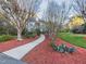 Well-maintained two-story home with manicured lawn and a paved walkway, showcasing curb appeal at 101 Sundance Pl, Chapel Hill, NC 27514