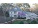 Charming two-story home with a beautifully landscaped yard and blossoming trees in a suburban setting at 101 Sundance Pl, Chapel Hill, NC 27514