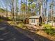 View of backyard with a pavilion and shed on a sunny day at 101 Sundance Pl, Chapel Hill, NC 27514