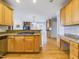 Well-equipped kitchen featuring granite countertops, stainless steel appliances, and light wood cabinetry at 101 Sundance Pl, Chapel Hill, NC 27514