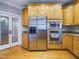 Bright kitchen is equipped with stainless steel appliances and light wood cabinetry with granite countertops at 101 Sundance Pl, Chapel Hill, NC 27514
