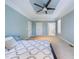 Bright main bedroom featuring neutral walls, carpeting, ceiling fan, and ensuite bathroom at 101 Sundance Pl, Chapel Hill, NC 27514