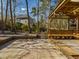 Backyard patio featuring tile and a covered pavilion with wooden bench seating at 101 Sundance Pl, Chapel Hill, NC 27514