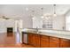 Open floor plan showcasing the kitchen with granite countertops and stainless steel dishwasher and sink at 10411 Rosegate Ct # 202, Raleigh, NC 27617