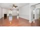 Bright living room with hardwood floors, ceiling fans, fireplace, and sliding glass doors to the outdoors at 10411 Rosegate Ct # 202, Raleigh, NC 27617