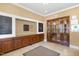 Welcoming lobby with mailboxes, warm lighting, and lovely wood entry doors at 10411 Rosegate Ct # 202, Raleigh, NC 27617