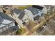 Aerial view of well-maintained homes showcasing rooflines and landscaping in a suburban neighborhood at 105 Della St, Chapel Hill, NC 27516