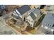 Aerial view of homes showcasing rooflines and landscaping in a suburban neighborhood at 105 Della St, Chapel Hill, NC 27516
