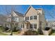Charming two-story home with manicured landscaping and inviting entryway at 105 Della St, Chapel Hill, NC 27516