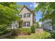 Charming two-story home with a well-manicured lawn and inviting curb appeal, showcasing a cozy residential atmosphere at 105 Della St, Chapel Hill, NC 27516