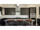 Modern kitchen with granite countertops, stainless steel appliances, and stylish barstools at 105 Della St, Chapel Hill, NC 27516