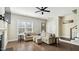 Open-concept living area with hardwood floors, plenty of light, and stylish furniture at 105 Della St, Chapel Hill, NC 27516