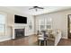 Inviting living room with fireplace, sofa, and abundant natural light at 105 Della St, Chapel Hill, NC 27516