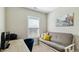 Well-lit home office space with a comfortable sofa, a view from the window, and office equipment at 105 Della St, Chapel Hill, NC 27516