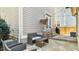 Charming outdoor patio with stone floor, cozy seating, and convenient access to the home at 105 Della St, Chapel Hill, NC 27516