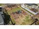 Aerial view of neighborhood playground with swings, slides, and play structures at 105 Della St, Chapel Hill, NC 27516