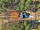 Aerial view of a newly constructed home showcasing its roofline, driveway and surrounding lot at 109 Mohawk Dr, Louisburg, NC 27549