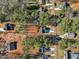 An aerial view of homes nestled among trees, with driveways and landscaping at 109 Mohawk Dr, Louisburg, NC 27549