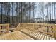 Expansive backyard deck overlooking a private wooded area with natural sunlight at 109 Mohawk Dr, Louisburg, NC 27549