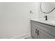 Bathroom featuring a gray vanity with dark fixtures, white countertops, and a mosaic tile floor at 109 Mohawk Dr, Louisburg, NC 27549