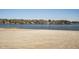 A bright sandy beach borders a tranquil lake, perfect for relaxation and fun at 109 Mohawk Dr, Louisburg, NC 27549