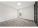 Minimalist bedroom featuring a window and neutral carpet at 109 Mohawk Dr, Louisburg, NC 27549