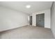 Spacious bedroom featuring neutral carpeting, fresh paint, and a double-door closet at 109 Mohawk Dr, Louisburg, NC 27549