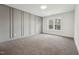 Bedroom showcases stylish gray paneled walls and a bright, inviting atmosphere with natural light at 109 Mohawk Dr, Louisburg, NC 27549