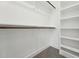 Walk-in closet with built-in shelving and ample storage space at 109 Mohawk Dr, Louisburg, NC 27549