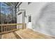 Spacious wood deck leads to the backyard and showcases a back entrance into the home at 109 Mohawk Dr, Louisburg, NC 27549