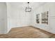 Bright dining area featuring modern lighting, panel molding, and large windows at 109 Mohawk Dr, Louisburg, NC 27549