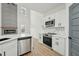 Well-lit kitchen featuring stainless steel appliances, marble backsplash, and an open concept design at 109 Mohawk Dr, Louisburg, NC 27549