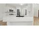 Modern kitchen boasts white cabinets, stainless appliances, and a gorgeous marble countertop island at 109 Mohawk Dr, Louisburg, NC 27549