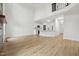 Open floor plan with hardwood floors and view of the modern kitchen at 109 Mohawk Dr, Louisburg, NC 27549