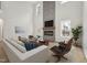 Bright living room with fireplace, hardwood floors, and large windows at 109 Mohawk Dr, Louisburg, NC 27549