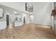 Open floor plan with hardwood floors and view of the modern kitchen at 109 Mohawk Dr, Louisburg, NC 27549