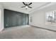 Spacious main bedroom with a tray ceiling, neutral color scheme, and large windows at 109 Mohawk Dr, Louisburg, NC 27549