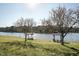 Lakeside park with picnic shelters, trees, and scenic water views at 109 Mohawk Dr, Louisburg, NC 27549