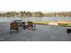 Outdoor seating and lake views create a relaxing patio experience for gatherings at 109 Mohawk Dr, Louisburg, NC 27549