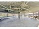 Outdoor pavilion with picnic tables, concrete floor, and lake views at 109 Mohawk Dr, Louisburg, NC 27549