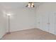 Neutral bedroom with carpet and ample closet space, a ceiling fan, and a floor lamp at 1101 Esher Ct, Raleigh, NC 27609