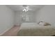 Cozy bedroom with a comfortable queen-sized bed, ceiling fan, and natural light streaming through the window at 1101 Esher Ct, Raleigh, NC 27609