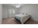 Comfortable bedroom featuring a window, ceiling fan, and neutral paint at 1101 Esher Ct, Raleigh, NC 27609