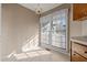 Sunny breakfast nook features lots of windows, neutral paint, and tile flooring at 1101 Esher Ct, Raleigh, NC 27609